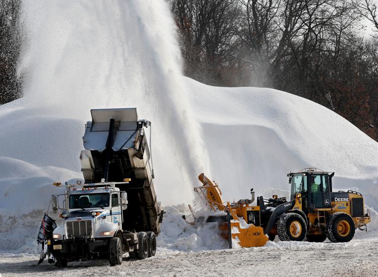 Snow Stacking, Relocating and Hauling Snow Off Site Service